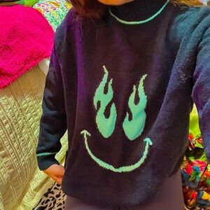 Adika smiley face black oversized sweater